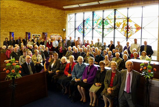 The congregation beside the stained glass window - click for larger picture
